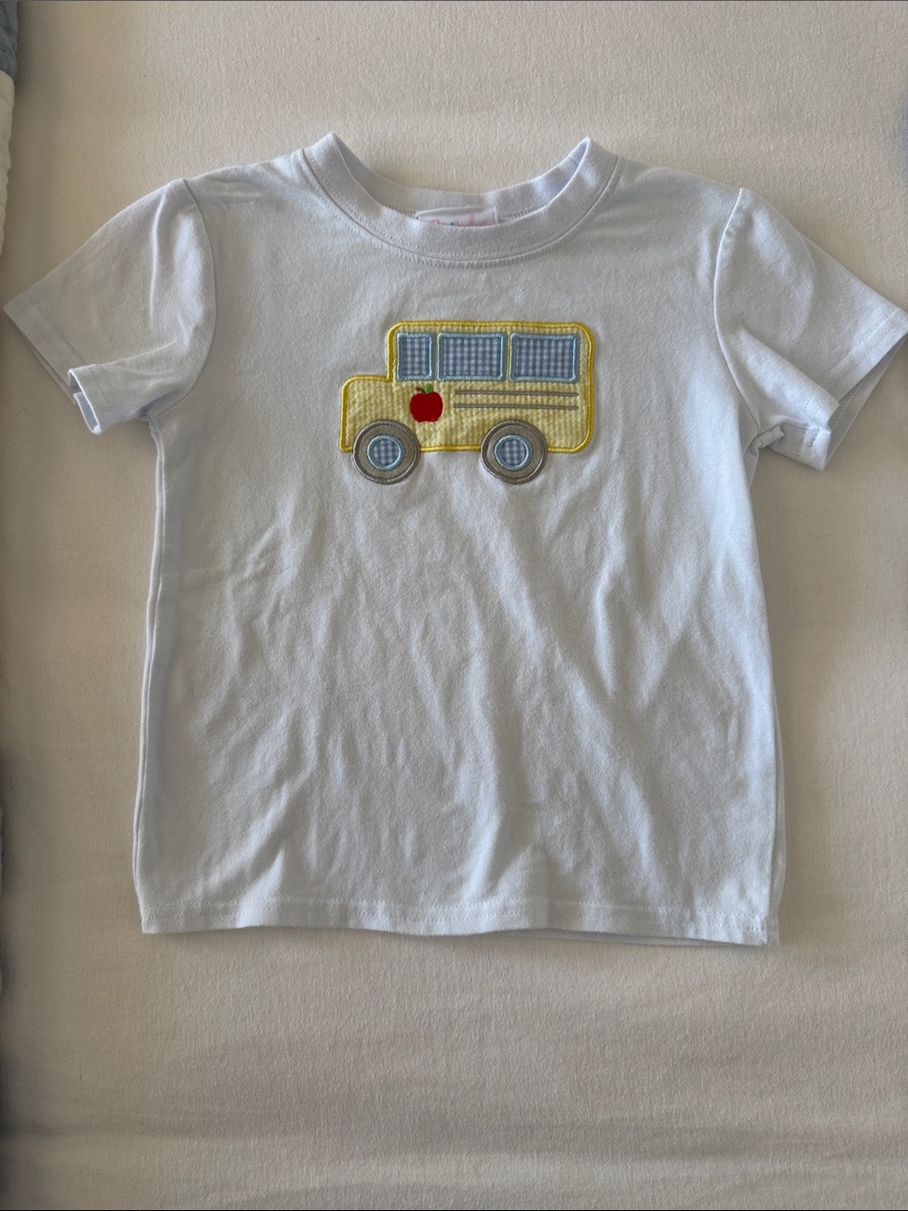 Stitchy Fish White Short-Sleeve Kids Tee with Yellow Bus Appliqué